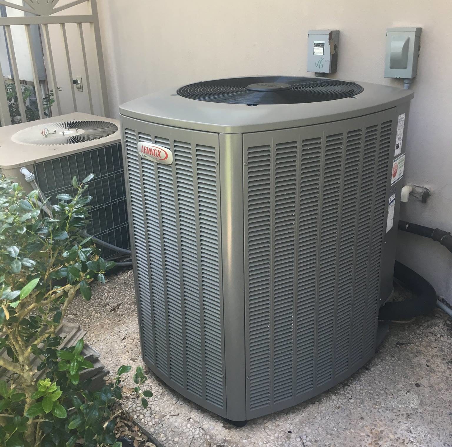 lennox air conditioning unit outside of house